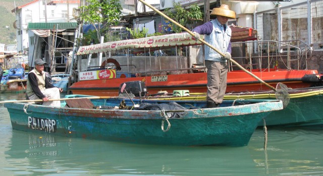 Tanka man on boat in Hong Kong