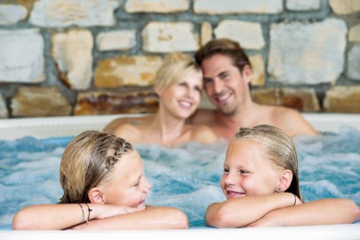 Family in a large jacuzzi