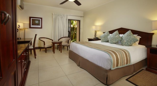 Guest room at Manchebo Beach Resort and Spa